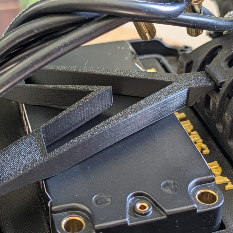 Close-up of battery strap installed on Team Associated B5M buggy